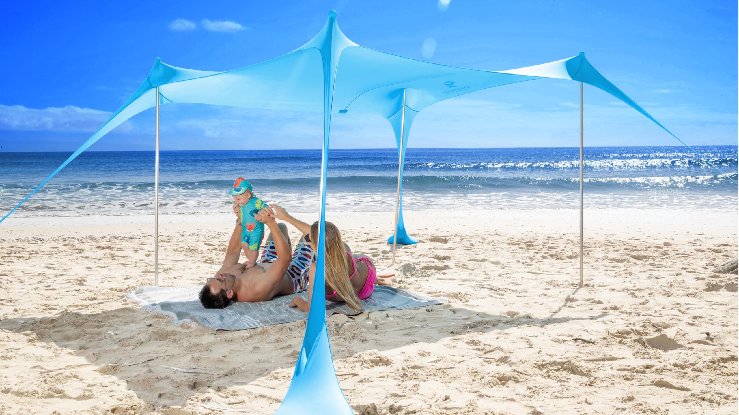 SUN NINJA Carpa Playa Plegable - Toldo Playa Plegable con Protección UPF 50+ - Toldo Camping con Bolsa de Transporte - con Pala Estacas y Postes - Parasol Playa Camping Pesca